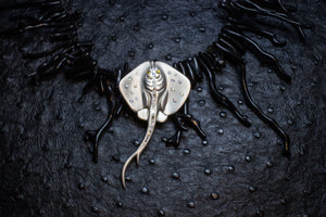 Manta ray pendant on black coral necklace